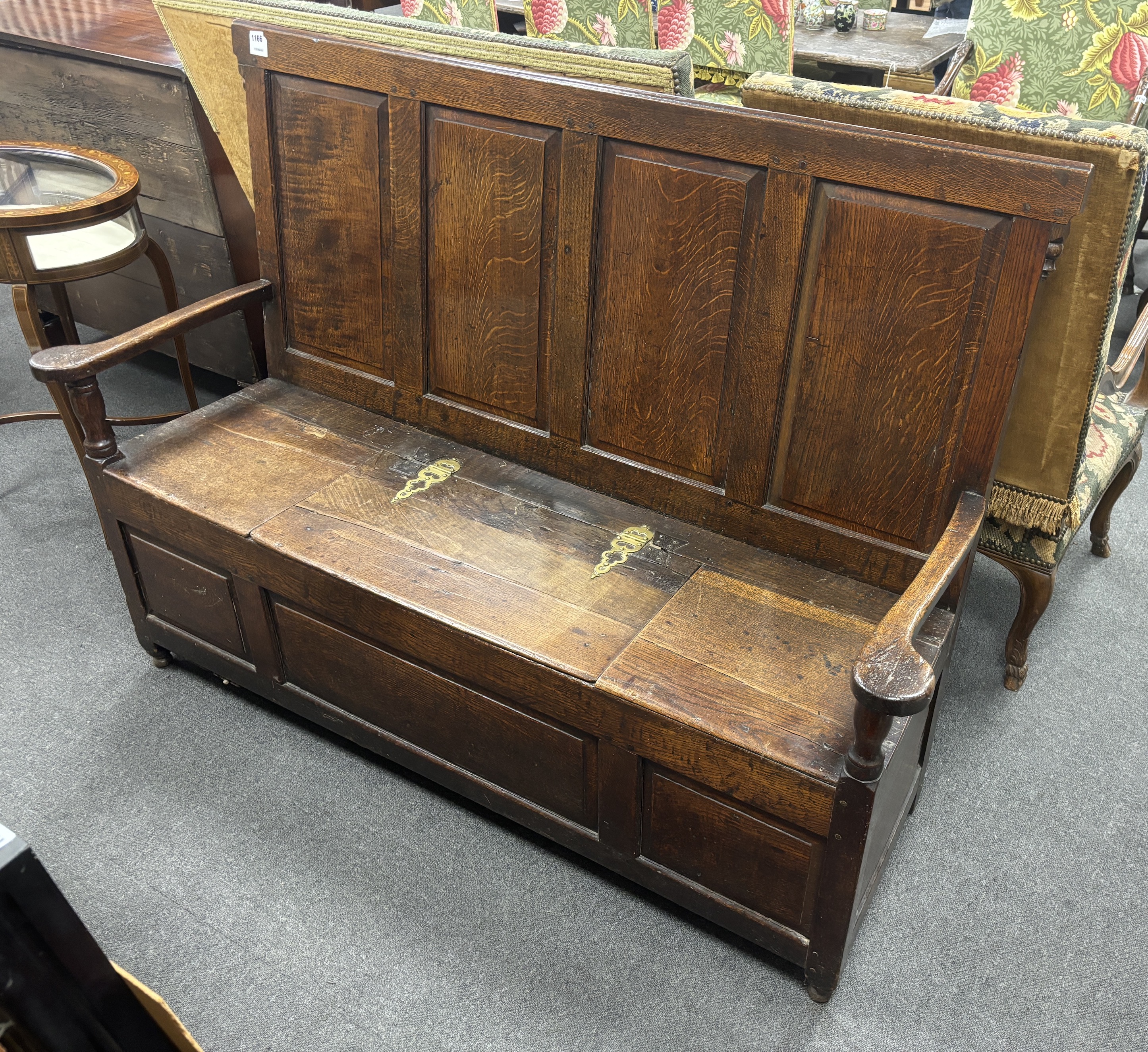 An 18th century panelled oak box seat settle, width 153cm, depth 51cm, height 108cm